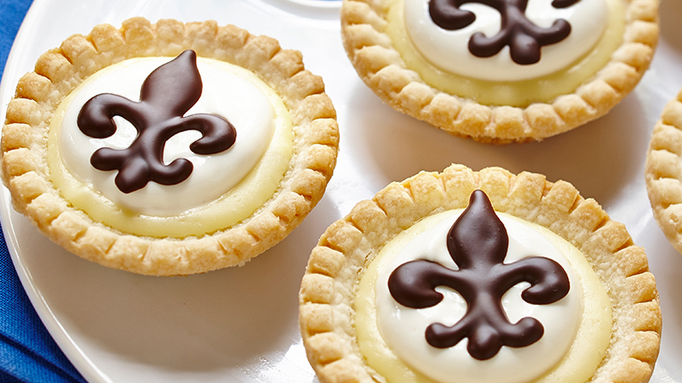 Cheesecake Tarts with Sour Cream Topping and Chocolate Fleur de Lis